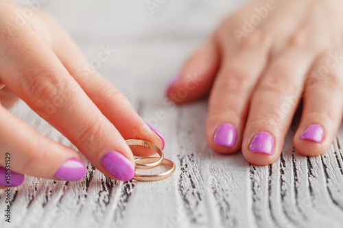 Two gold wedding rings on arm. Small depth of field.