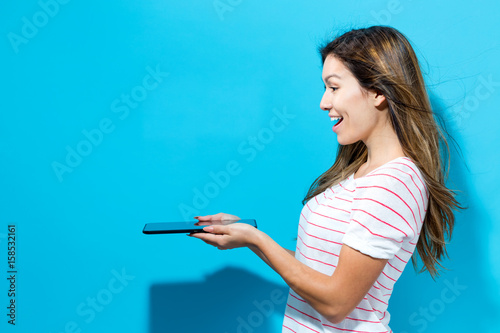 Young woman using her tablet