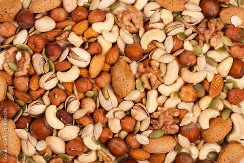 Mix of different nuts as background close-up photo