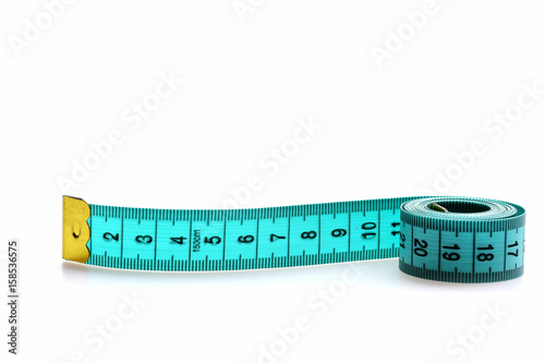 Roll of greenish blue measuring tape isolated on white background