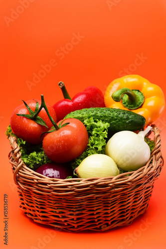 organic food concept  vegetables  lettuce leaf  tomatoes  onions  peppers  cucumber