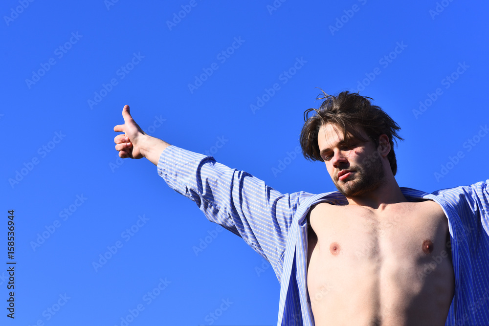 Caucasian macho in blue striped pajamas Caucasian macho in blue striped pajamas