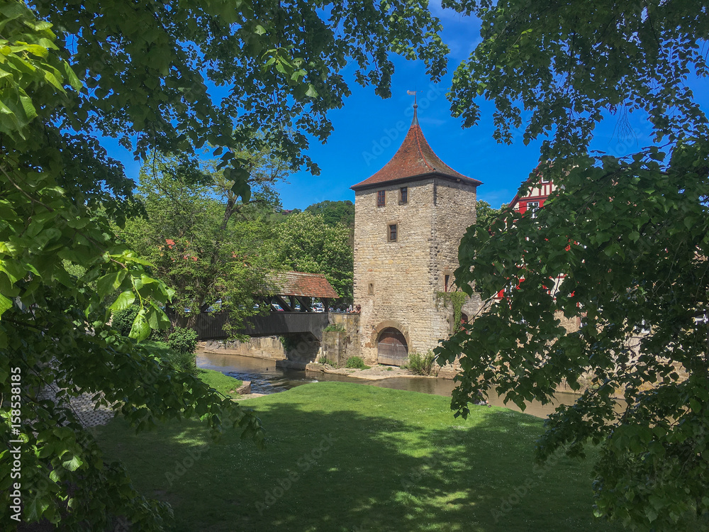 Medieval Tower and City Wall in Germany Framed by Treelimbs