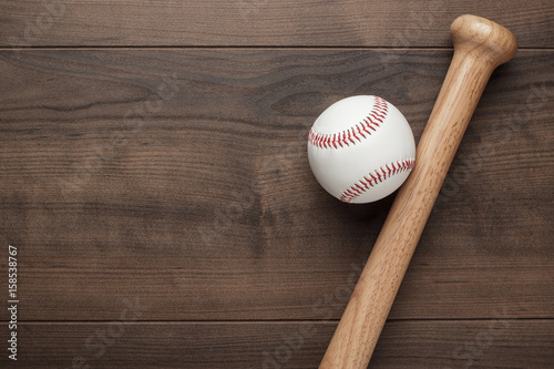 Canvas Print closeup of baseball bat and ball on wooden table with copy space