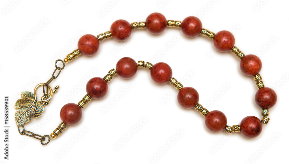 Nice necklace with red beads isolated on white background