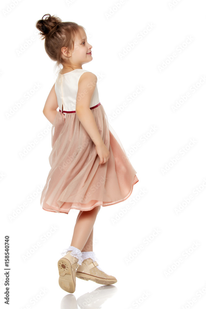 The little girl happily spinning.