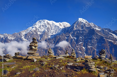 Mountain Landscape in Himalaya. Piramid of stones. Annapurna South peak, Hiun Chuli. photo