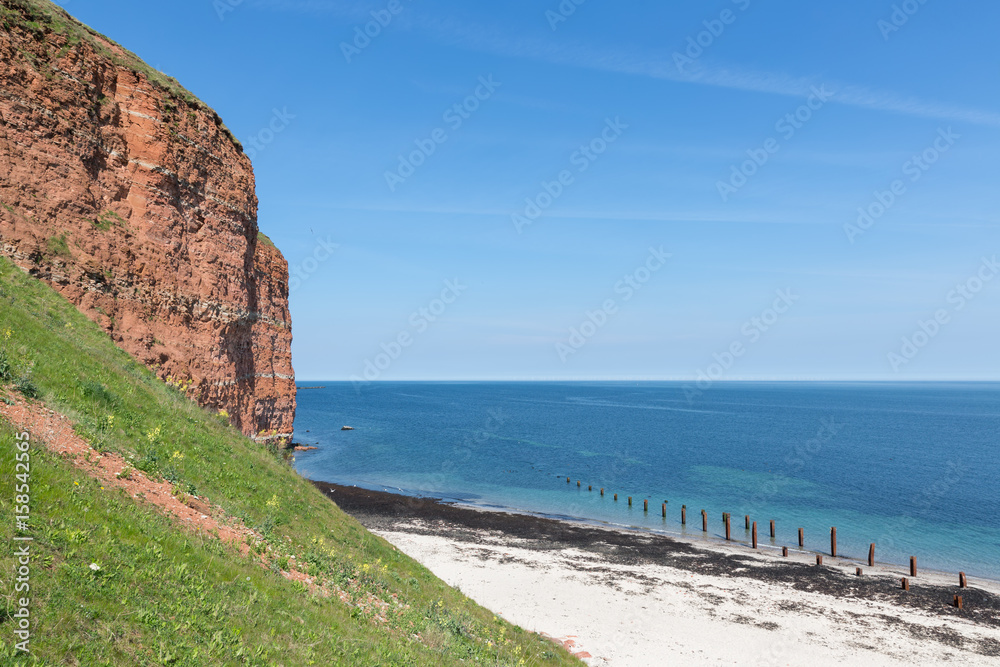 Red cliffs and beach at German island Helgoland