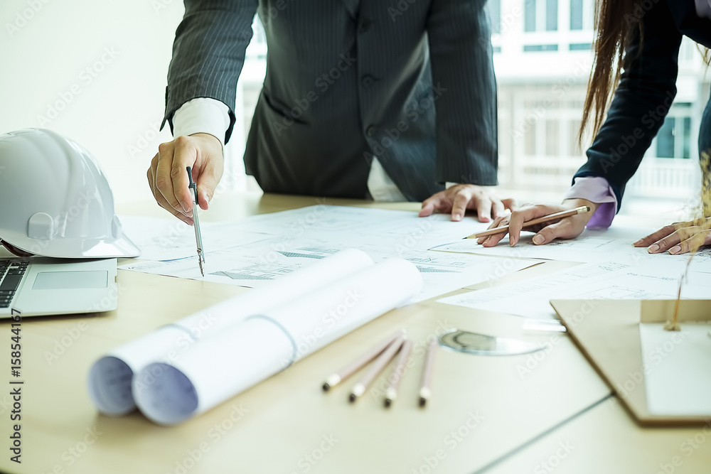 Fototapeta premium Image of engineer meeting for architectural project. working with partner and engineering tools on workplace