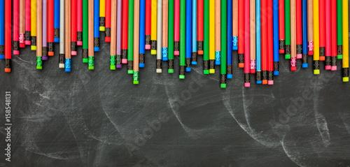 Colored pencils on a black board