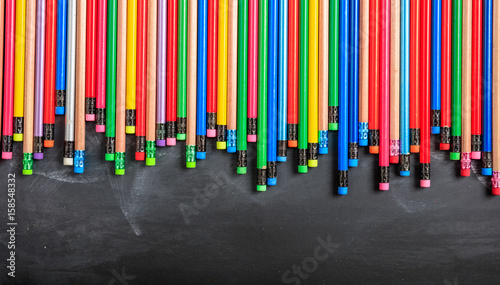 Colored pencils on a black board