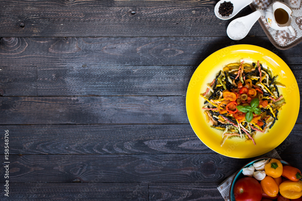 Delicious pasta with fresh vegetables and cheese, on a wooden background . Delicious pasta with fresh vegetables and cheese, on a wooden background .