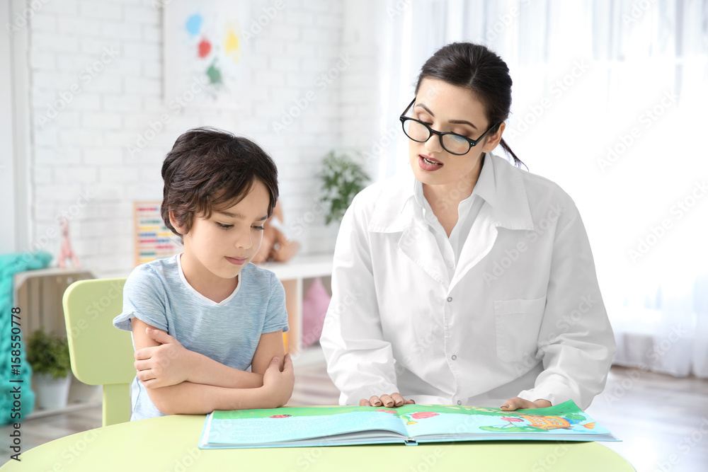 Young woman teacher and little boy on private lesson Young woman teacher and little boy on private lesson
