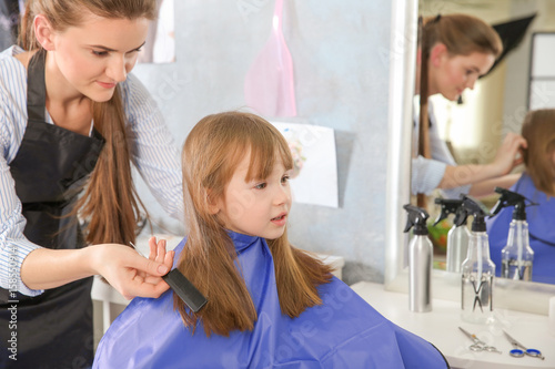 Cute little girl in hairdre...