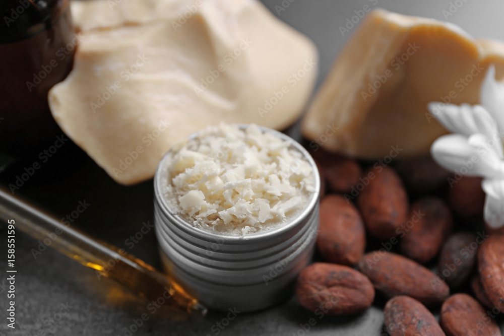 Beautiful composition with cocoa butter product on table Beautiful composition with cocoa butter product on table