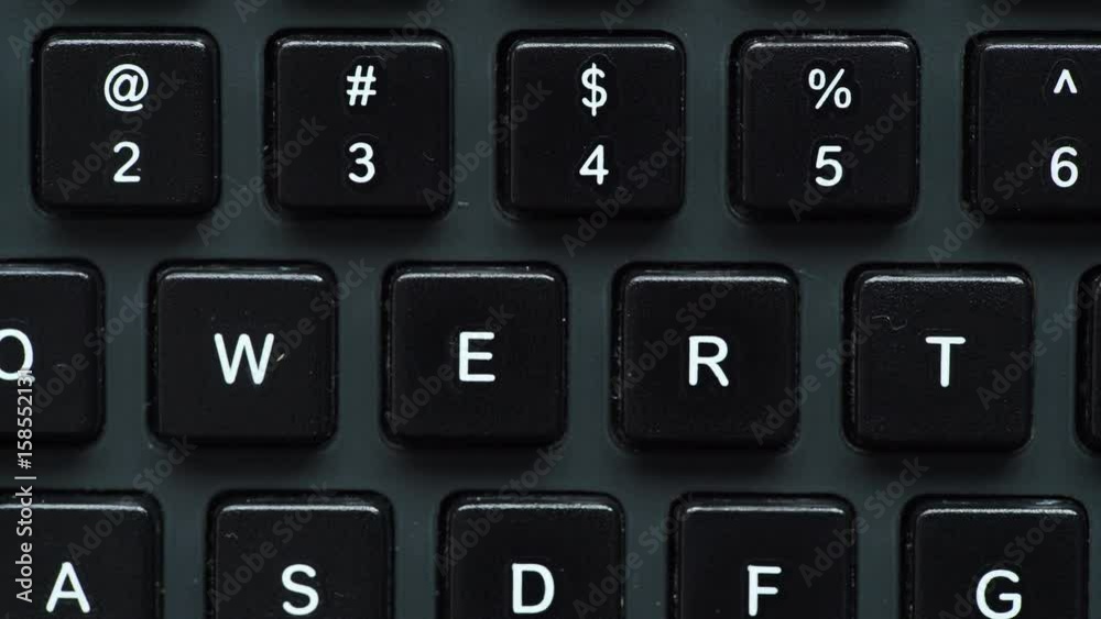 Black computer keyboard detail view closeup. Motorized slider 4K ProRes HQ codec Black computer keyboard detail view closeup. Motorized slider 4K ProRes HQ codec