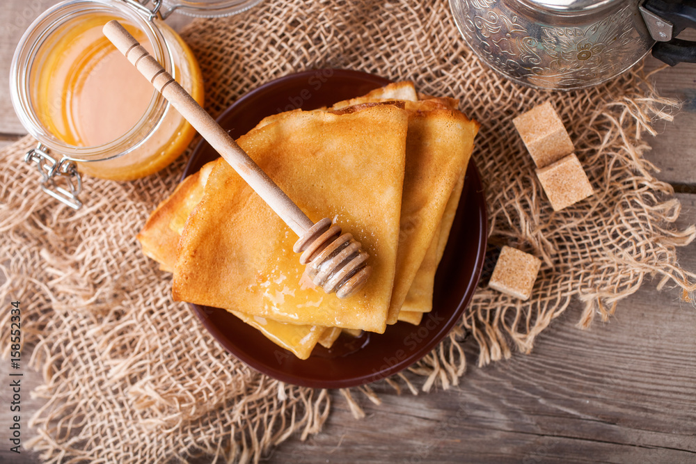 Pancakes with honey. Selective focus Pancakes with honey. Selective focus