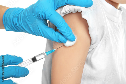 Doctor vaccinating child on white background  closeup