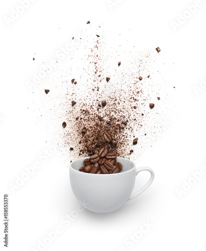 Coffee beans and powder spilled out from cup isolated on white background