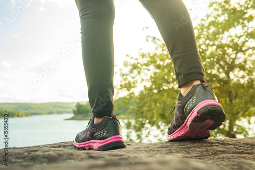 Young fitness women running at road.