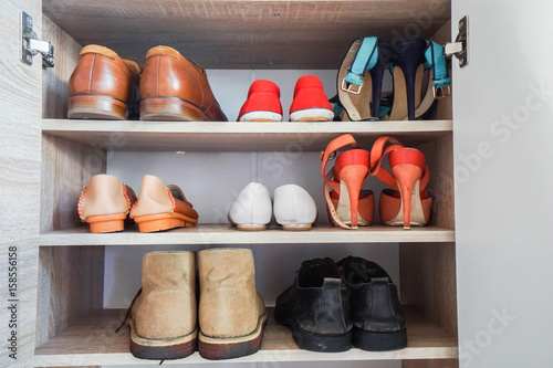men and women fashionable shoes in wardrobe for work