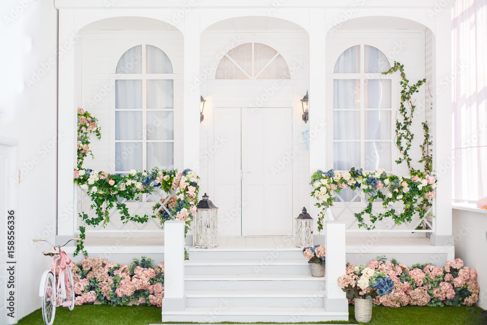 Classic white terrace. Spring pretty background. Spring and Easter mood. Shabby chic style Classic white terrace. Spring pretty background. Spring and Easter mood. Shabby chic style