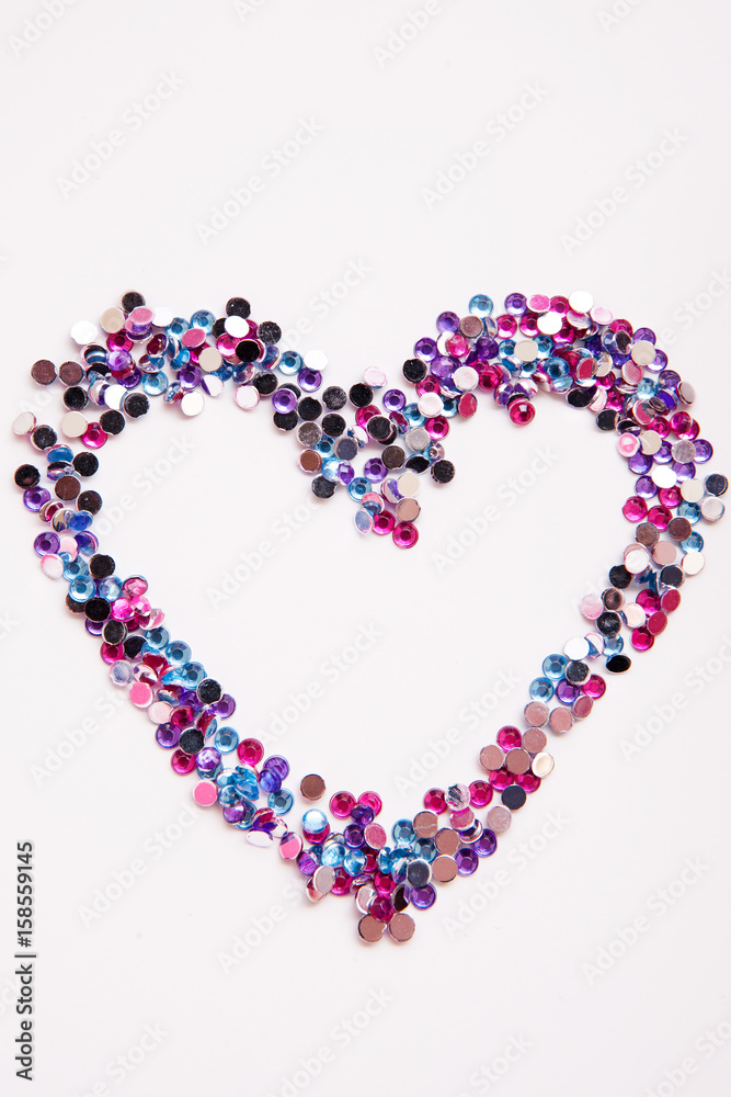 Rhinestone fashion background. Heart shape. Sewing decor, love and romance, abstract holiday backdrop.