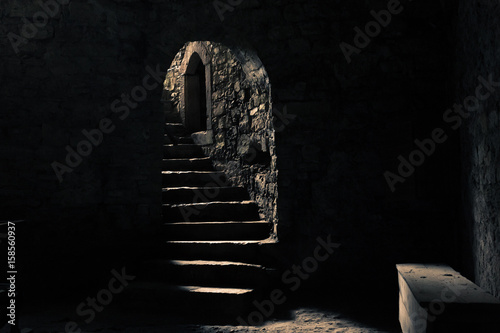 Castle dungeon with a beam of light photo
