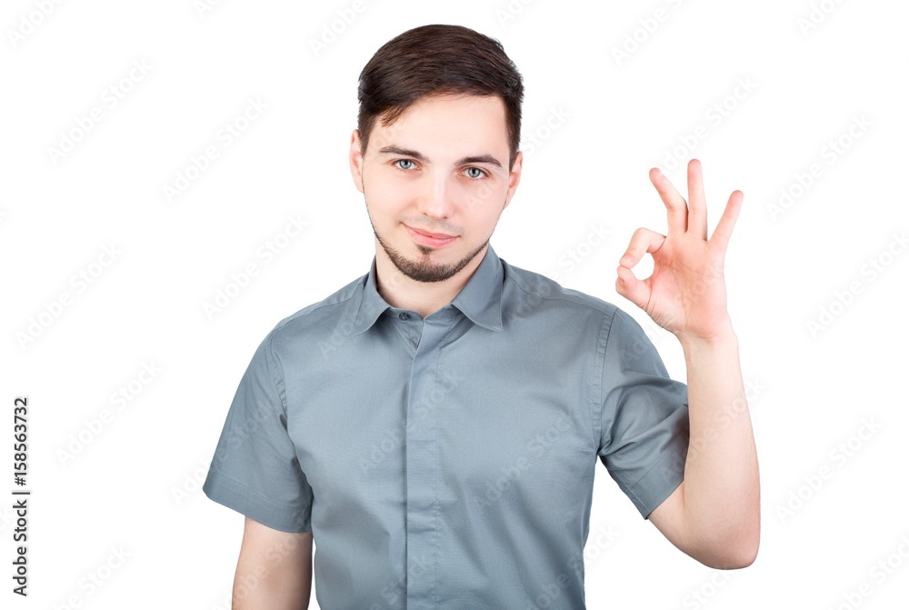 Cheerful young man showing OK gesture. Man showing Ok sign over white background. Handsome business man happy smile, businessman hold hand with ok gesture sign, isolated over white background Cheerful young man showing OK gesture. Man showing Ok sign over white background. Handsome business man happy smile, businessman hold hand with ok gesture sign, isolated over white background