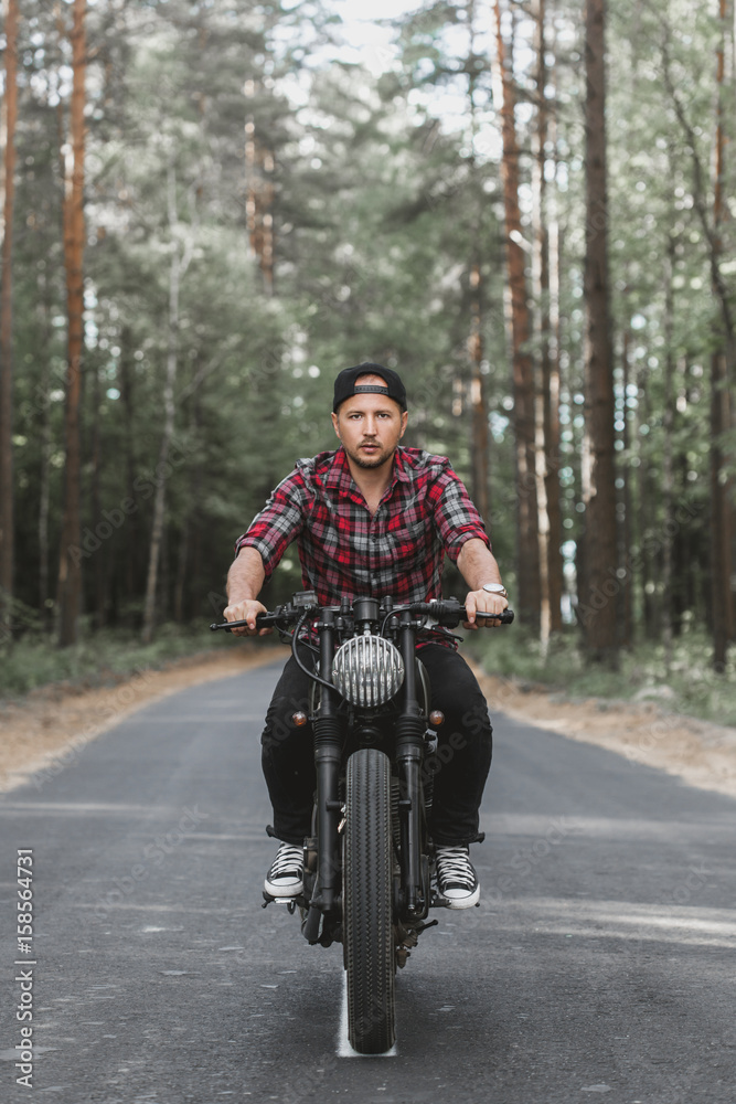 Man seat on the motorcycle Man seat on the motorcycle
