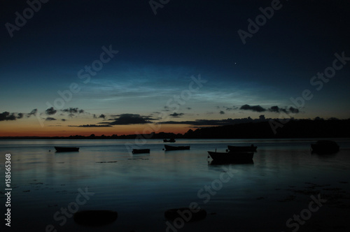 Fototapeta Naklejka Na Ścianę i Meble -  Steel blue Noctilucent Clouds seen from Denmark. The clods are high altitude night clouds illuminated by the sun at night.