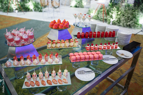 Stylish sweet candy buffe set at the wedding ceremony confectionery