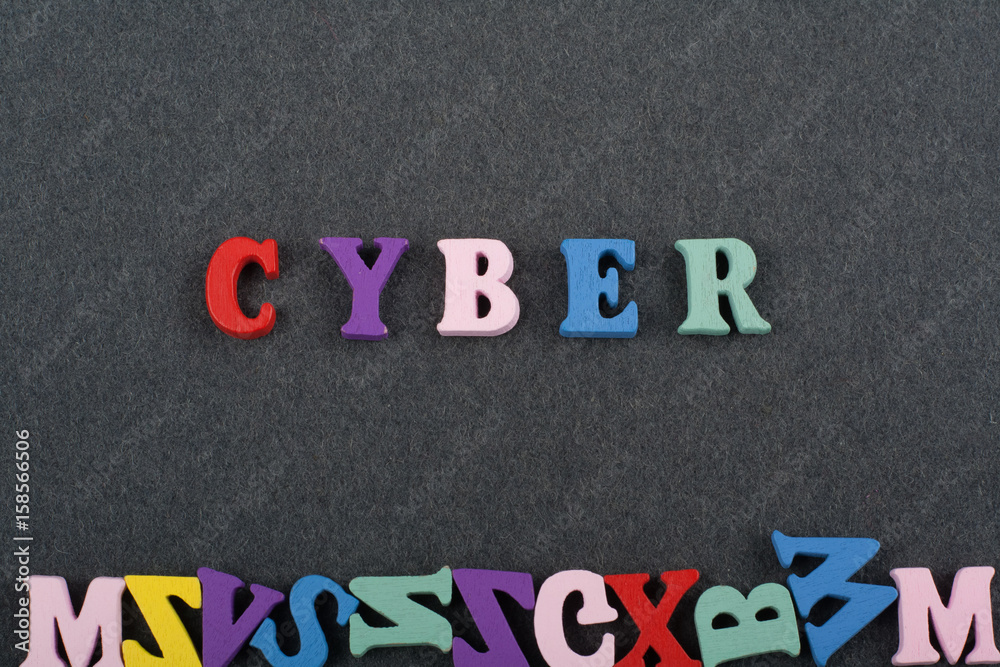 CYBER word on black board background composed from colorful abc alphabet block wooden letters, copy space for ad text. Learning english concept. CYBER word on black board background composed from colorful abc alphabet block wooden letters, copy space for ad text. Learning english concept.