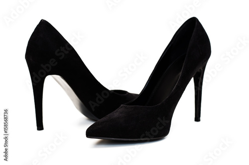 Black high heels shoes over white