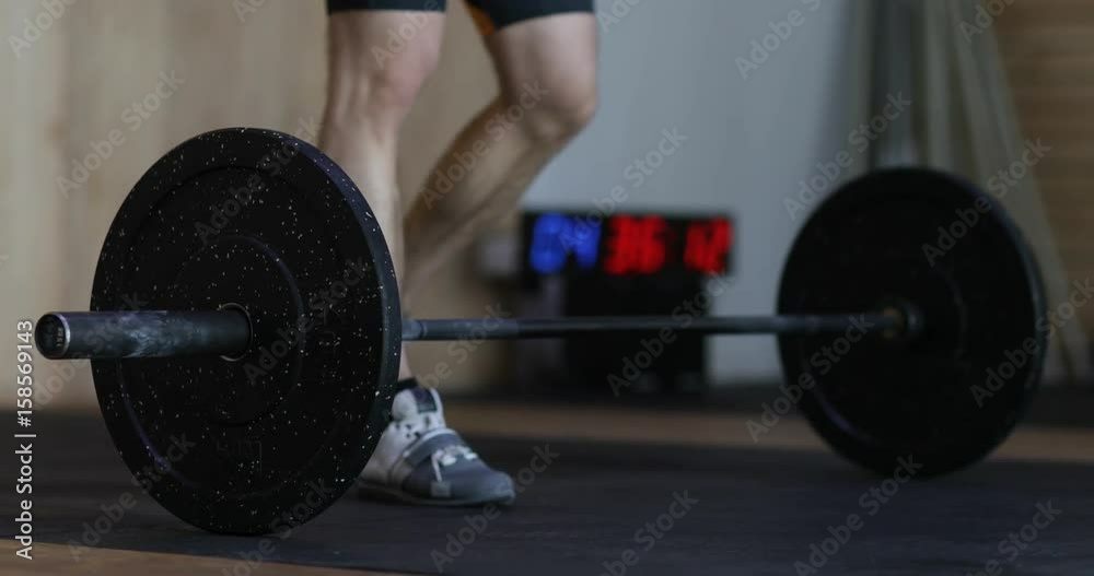 Man Prepares To Lift Heavy Barbell Doing Exercise During Workout Training At Gym Weightlifting Young Male Athlete Fitness Man Prepares To Lift Heavy Barbell Doing Exercise During Workout Training At Gym Weightlifting Young Male Athlete Fitness