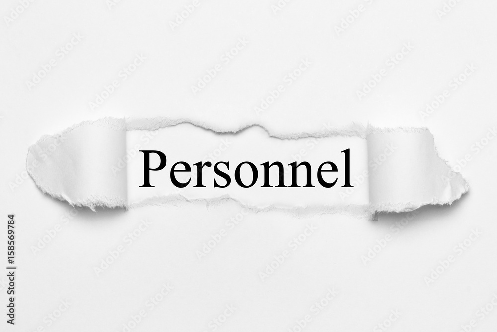Obraz premium Personnel on white torn paper
