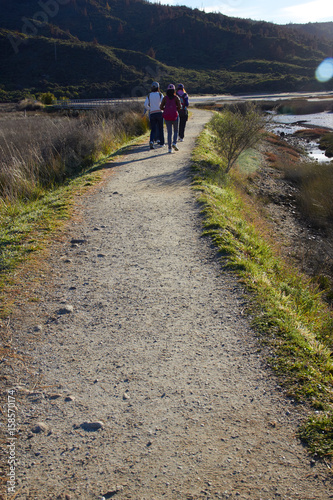 3 girls walking at national park walkway
