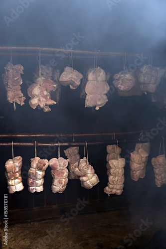Smoking meat in the smokehouse