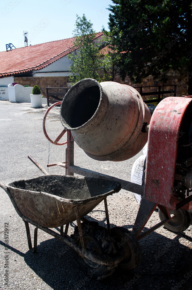Cement mixer machine with a standing stroller. Cement mixer machine with a standing stroller.