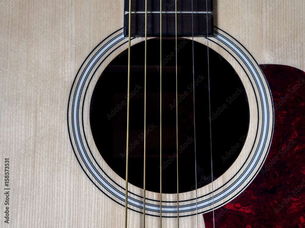 Obraz premium Close up shot of acoustic guitar. Strings, sound hole , bridge, pickguard