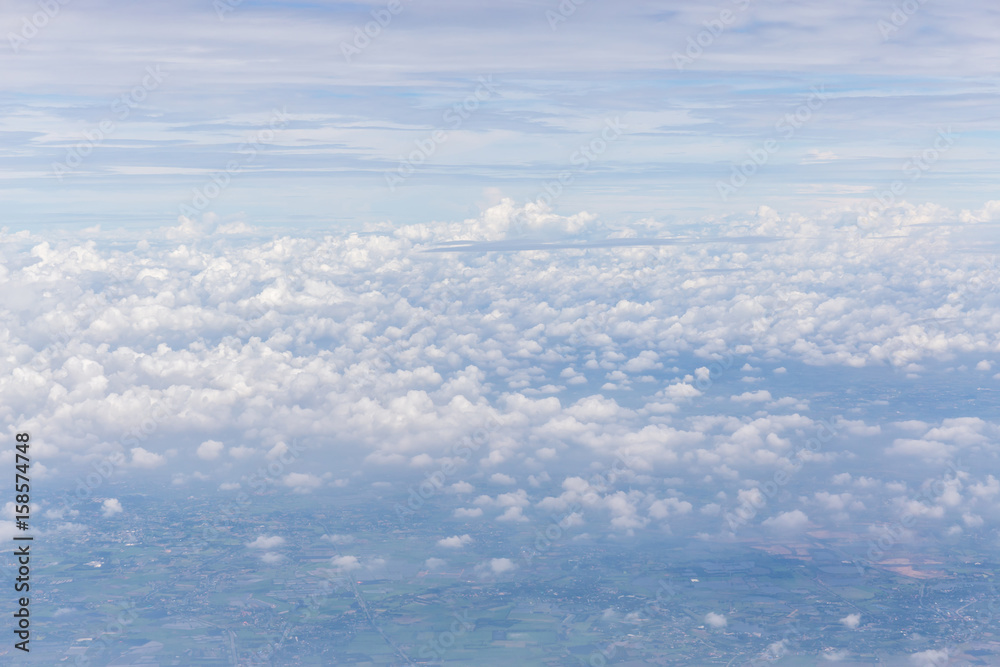 Texture and layer of white fluffy clouds spread on blue sky background.