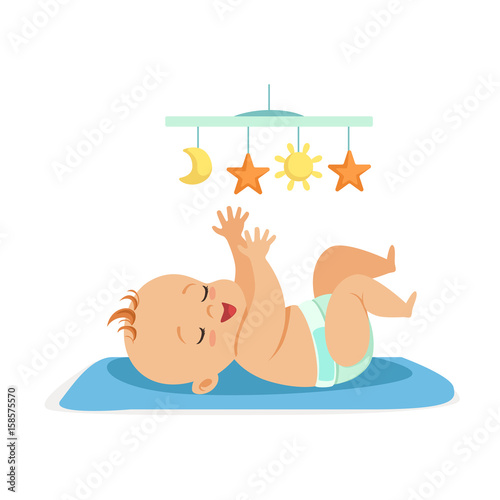 Cute naked baby in a diaper lying in bed and having fun with toy carousel, colorful cartoon character vector Illustration