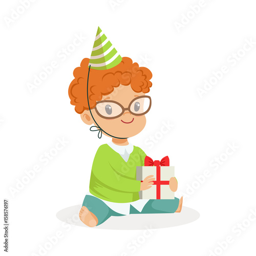 Adorable baby boy wearing a green party hat sitting with gift box. Childrens birthday party colorful cartoon character vector Illustration