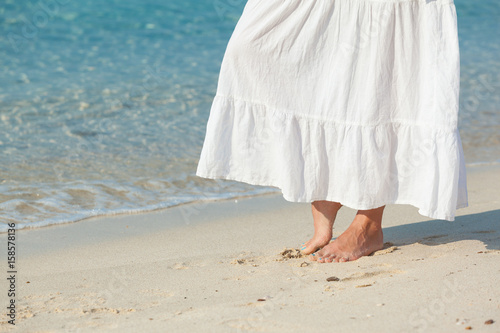  womans legs foot at beach in summer © arizanko