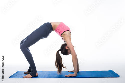 Young beauty Woman working yoga exercise isolated on white background