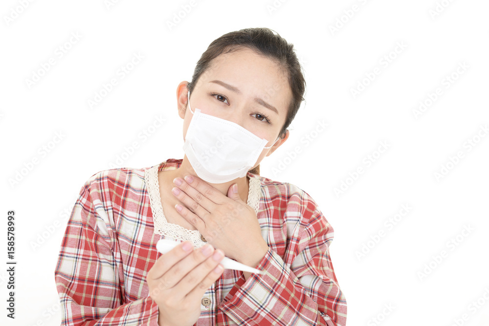 体調不良の女性