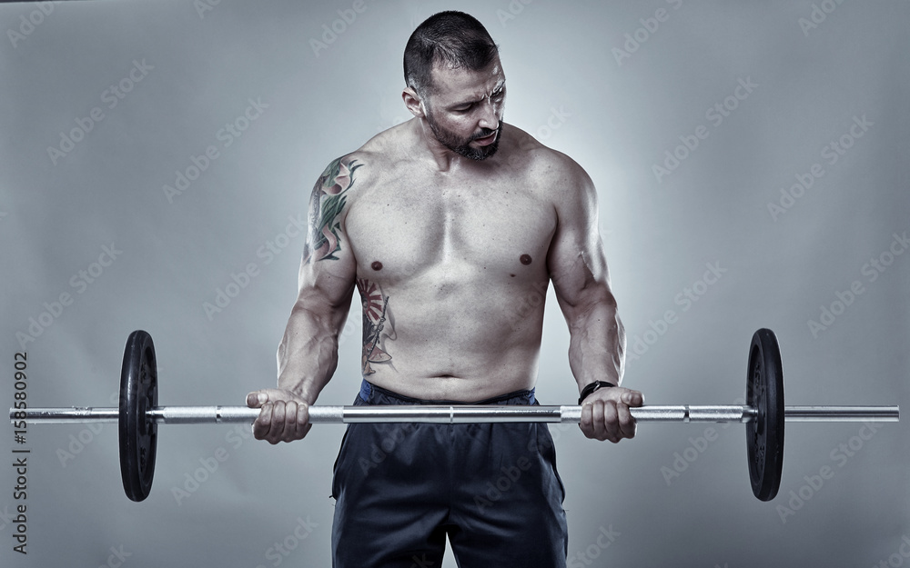 Man doing biceps curl with barbell Man doing biceps curl with barbell