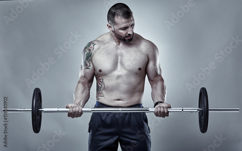 Man doing biceps curl with barbell
