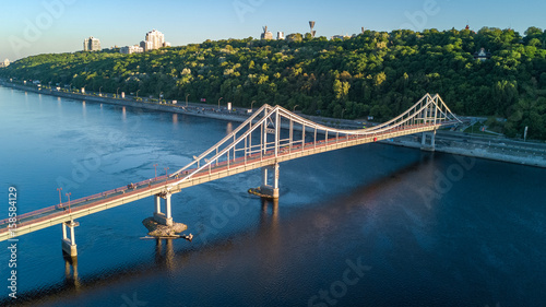 Aerial top view of pedestrian Park bridge and Dnieper river from above, city of Kiev, Ukraine 