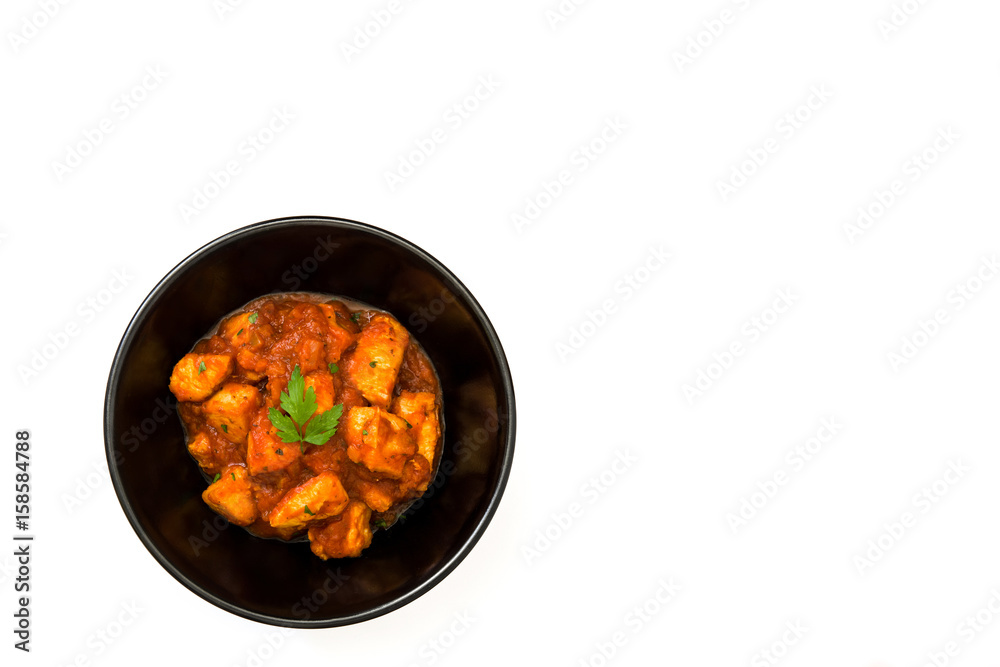 Chicken tikka masala in bowl isolated on white background
